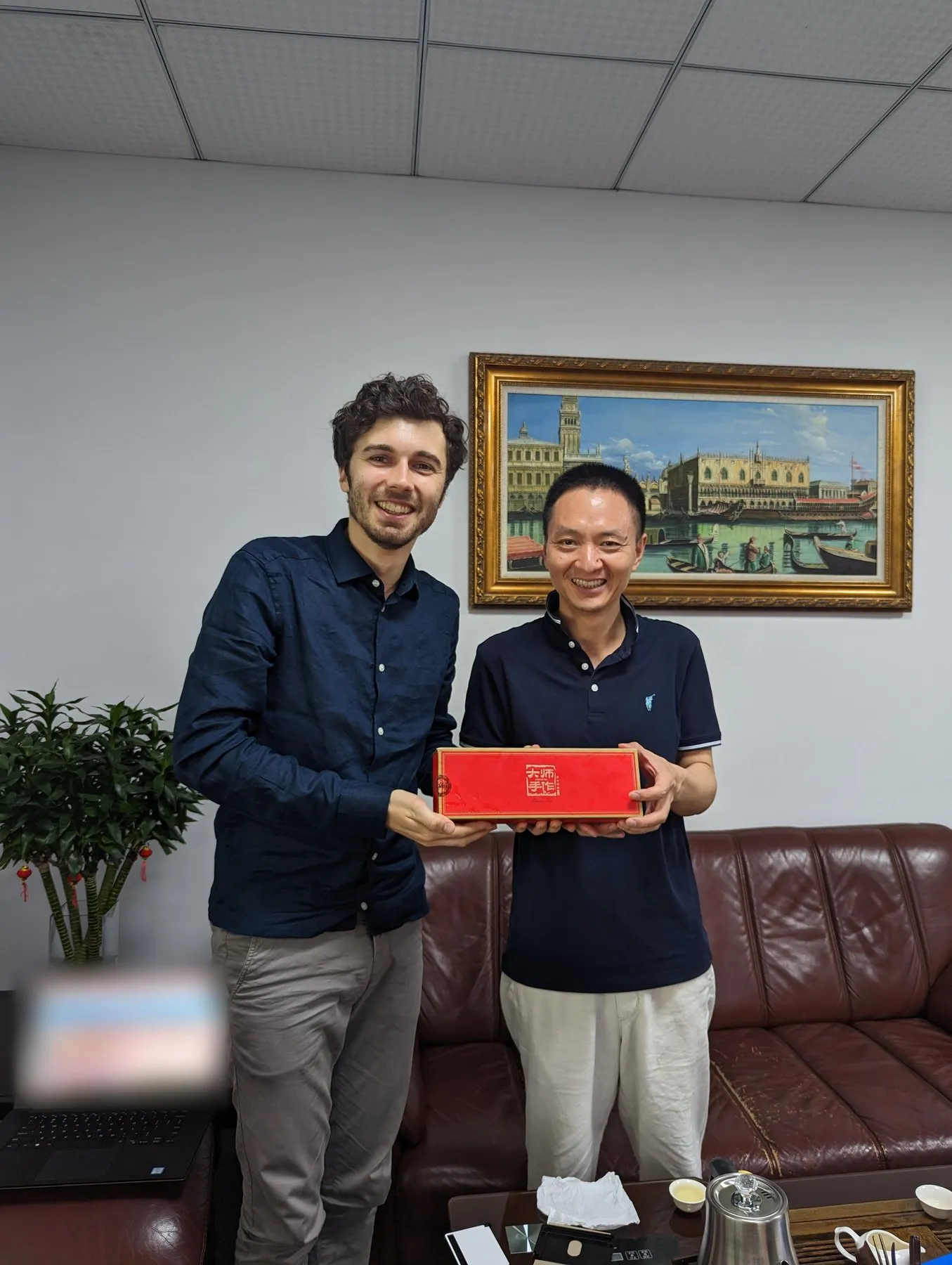 With a factory owner in their office