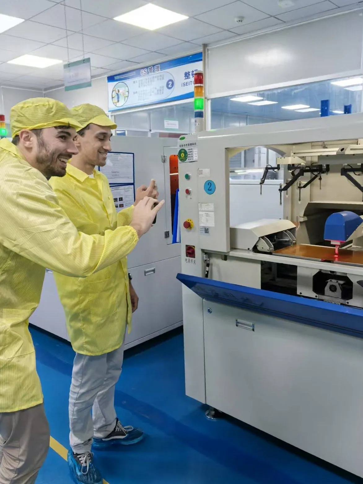 With Michaël Devid in cleanroom suits on an electronics assembly line